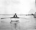 Unidentified man in rowing dinghy